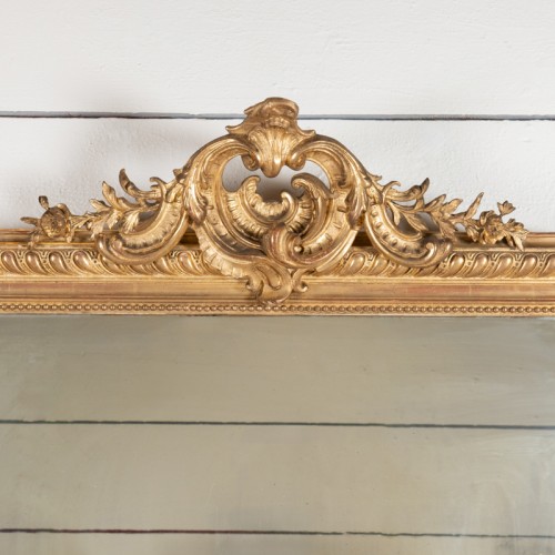 Very large carved mirror with small pediment - 