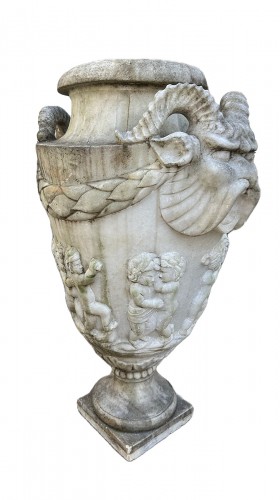 Four vases carved in white carrara marble