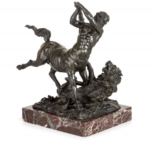 Centaur fighting a lion, patinated bronze group