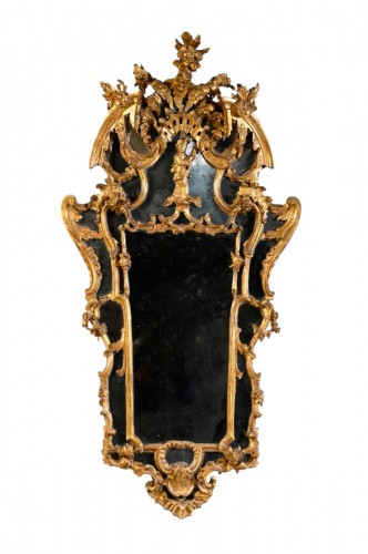 Pair of glazing mirrors in carved and gilded wood