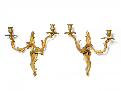 Pair of Louis XV period sconces in gilded bronze