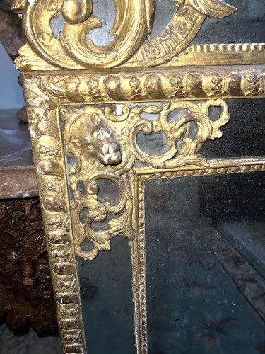 Miroirs, Trumeaux  - Miroir quadrangulaire à parecloses en bois doré d’époque Régence