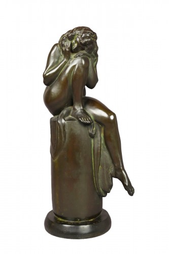 Seated woman by Henry Arnold