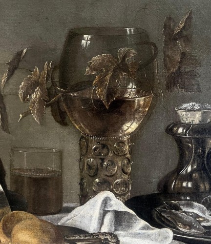 17th century Dutch Still-life - An opulent table with a roemer, oysters and wine - 