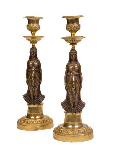 Pair of Empire period patinated and gilt bronze candlesticks