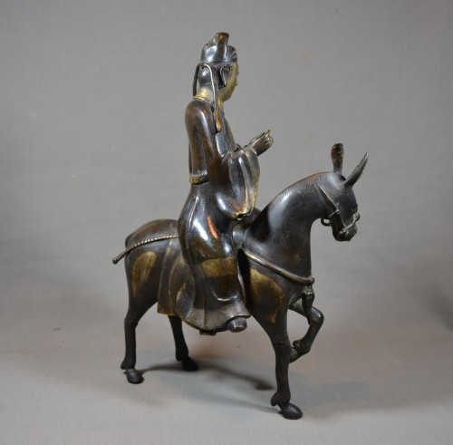 Antiquités - Su-Shi chevauchant sa mule en bronze doré d'époque Ming, Chine 17e siècle