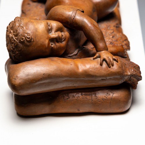 Antiquités - Reclining infant in terracotta, sign. F. Sans, probably Spain, Late 19th ce