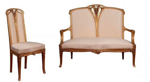 Sofa and chair in gilded and carved wood by Louis Majorelle