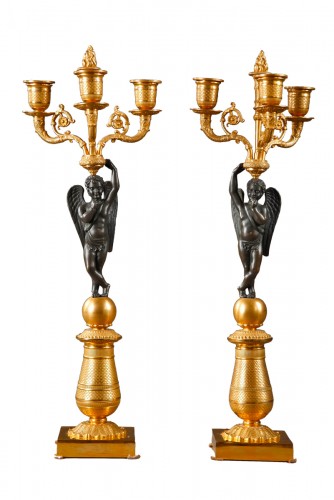 Pair of gilded and patinated bronze candelabras