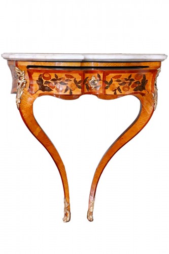 A rare pair of Louis XV marquetry console commodes 