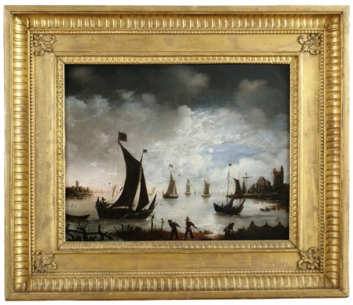 Dutch school of the 19th century, animated seascape of fishermen in the moonlight.