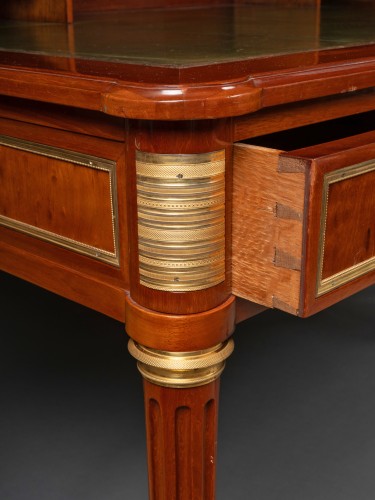 Antiquités - Jean Baptiste Courte. A Louis XVI mahogany bureau plat