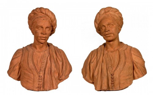 A pair of terracotta busts of oriental figures 