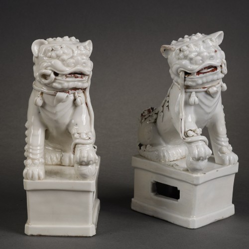 Asian Works of Art  - Pair of white Buddhist lions from China Dehua Kangxi period