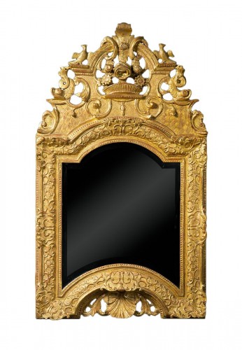 A Louis XIV period carved and gilded wood mirror
