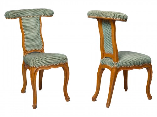 A Louis XV pair of Voyeuses chairs