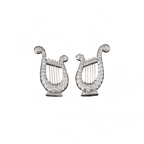 Pair of Lyre-shaped ear clips in diamonds.