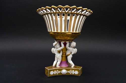 Porcelain & Faience  - Round pink and gold basket held by angels, Coussac-Bonneval in Limoges