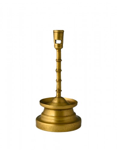 Very fine brass four-knop circular-based candlestick.
