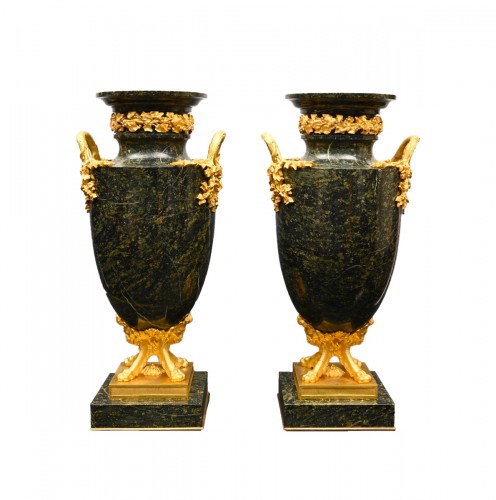 A pair of marble ornamental vases