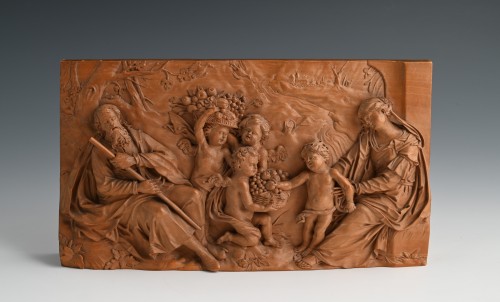 Relief en bois fruitier représentant Joseph, Marie, Jésus et trois chérubins apportant des fruits - Sculpture Style Renaissance