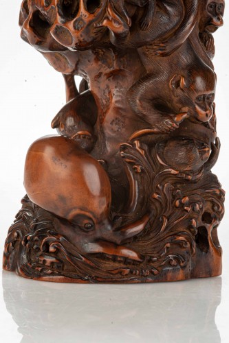 A Boxwood Okimono Depicting A Group Of Monkeys With An Octopus - 