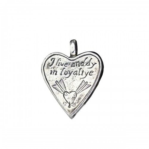 A Charles I silver heart shaped royalist locket