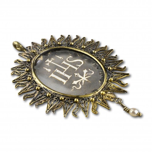 Antique Jewellery  - Silver gilt pendant with an enamelled glass ’IHS’