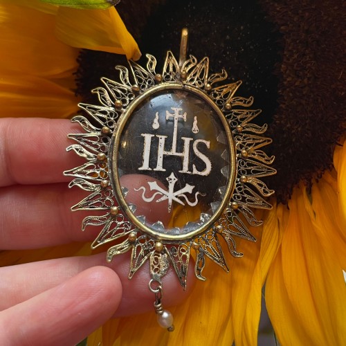  - Silver gilt pendant with an enamelled glass ’IHS’