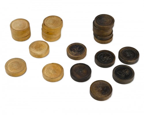 Twenty one stained and natural pear wood games pieces