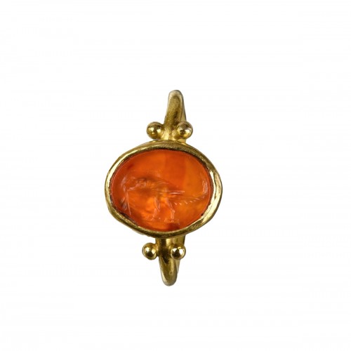 A gold ring set with a Roman intaglio of a Parrot