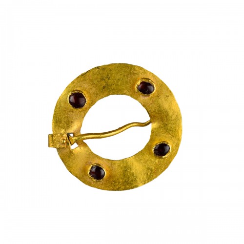 Medieval gold ring brooch set with garnets