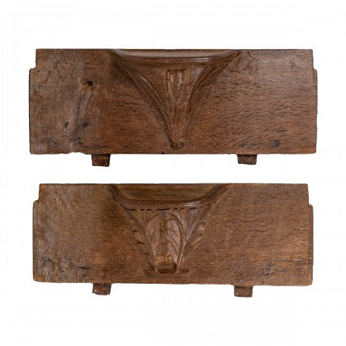 Two misericords with oak leaves and palm fronds