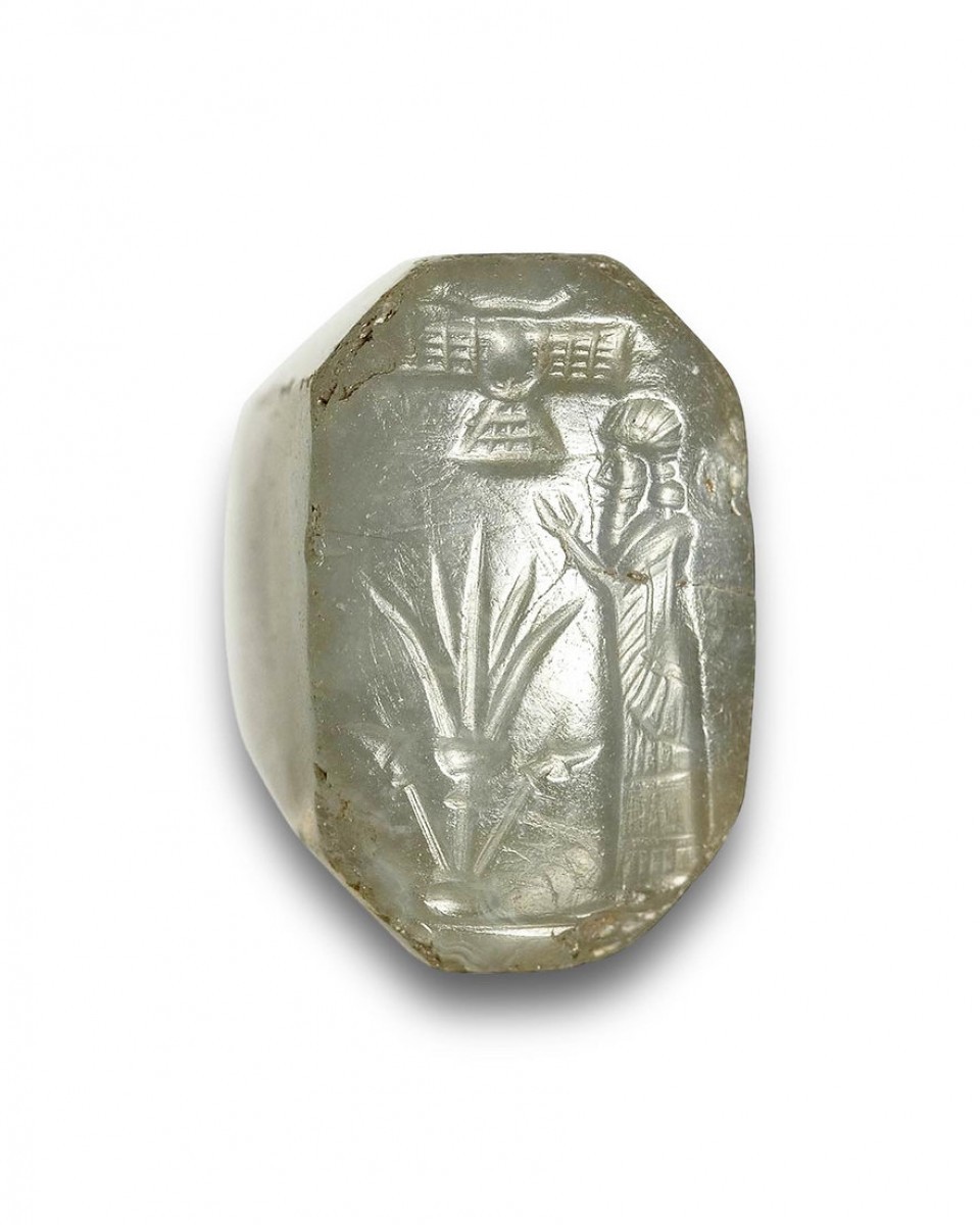 A bluish grey chalcedony stamp seal with a cultic scene. Ref.98163