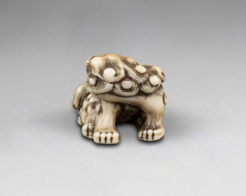 Netsuke – modèle en ivoire sculpté Shishi, Japon Edo - Reflets des Arts