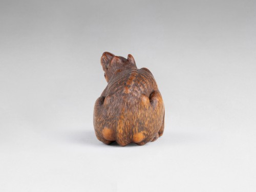 Asian Works of Art  - Netsuke By Kokei, Exceptional Model Of A Wolf With A Paw Holding A Skull. J