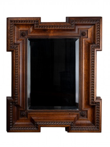 Walnut mirror, molded, carved with a frieze of hearts, 19th century