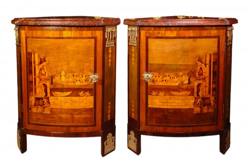 Pair of corner cabinets with architectural scenes, stamped Caumont