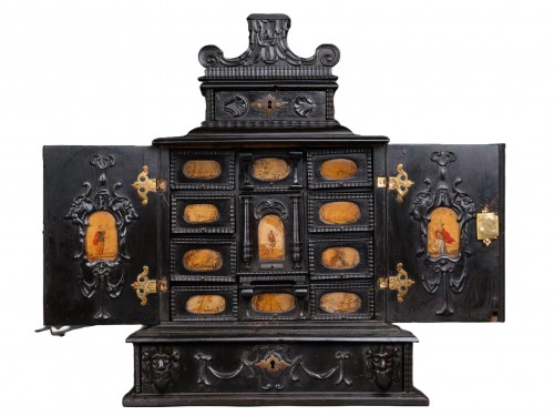 A 17th century Augsburg ebonized cabinet with painted pietra paesina panels