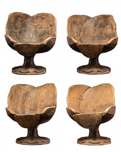 Four  hardwood chairs hand-carved out of one solid block 