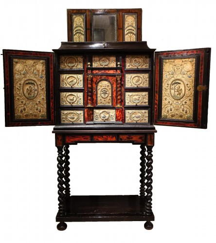 A tortoiseshell cabinet with gold and silver thread embroidery decoration